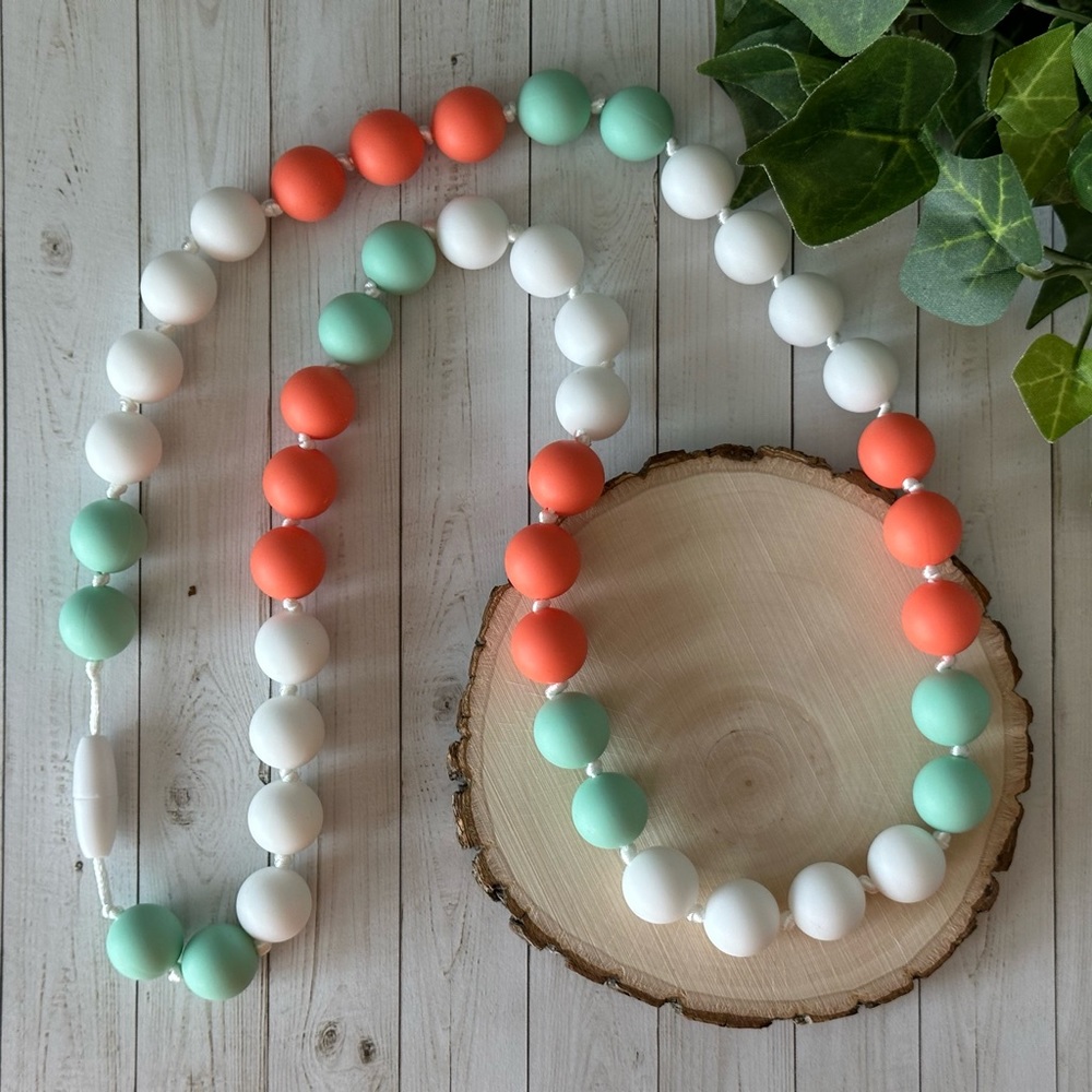 Handmade salmon/mint nursing necklace